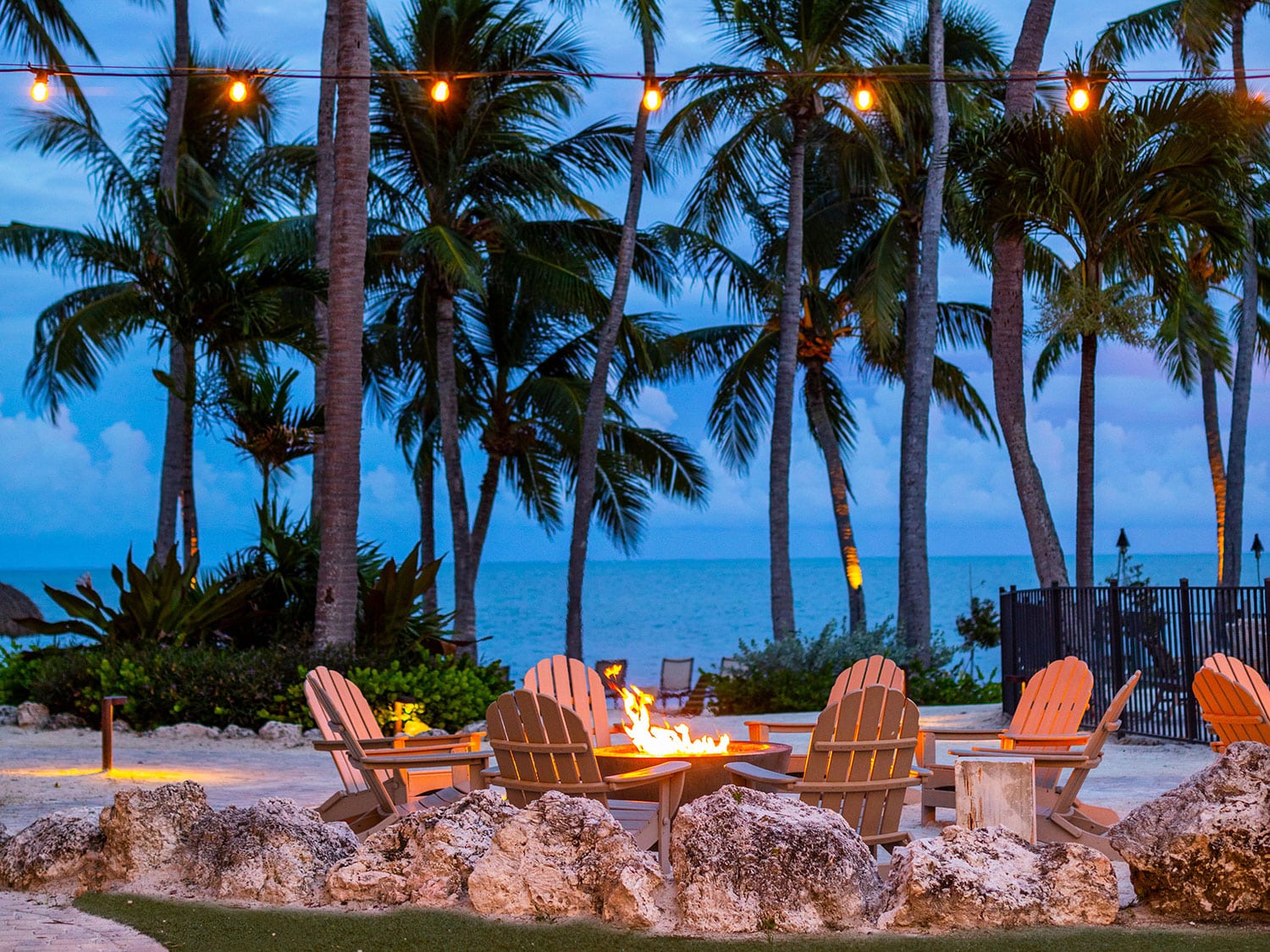 An outside seating area in the evening at Amara Cay Resort in Islamorada, Florida.