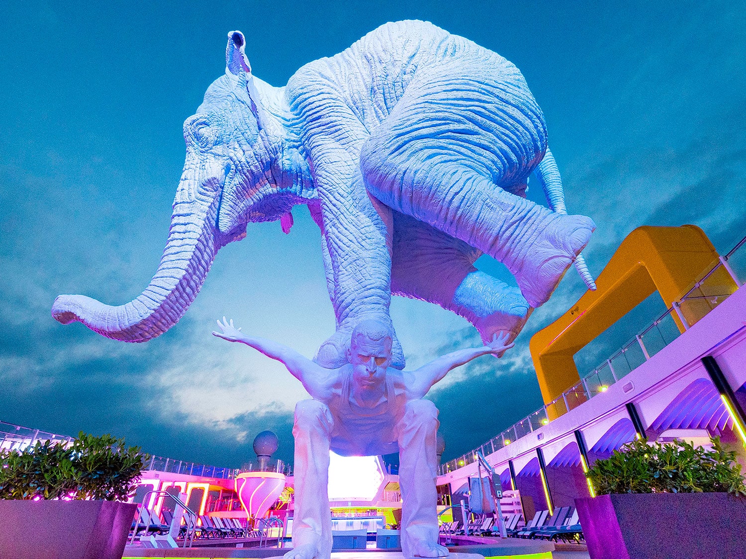 A sculpture of an elephant balancing on a man’s back, created by French sculptor Fabien Merelle’s L’origine for the Celebrity Beyond cruise ship.