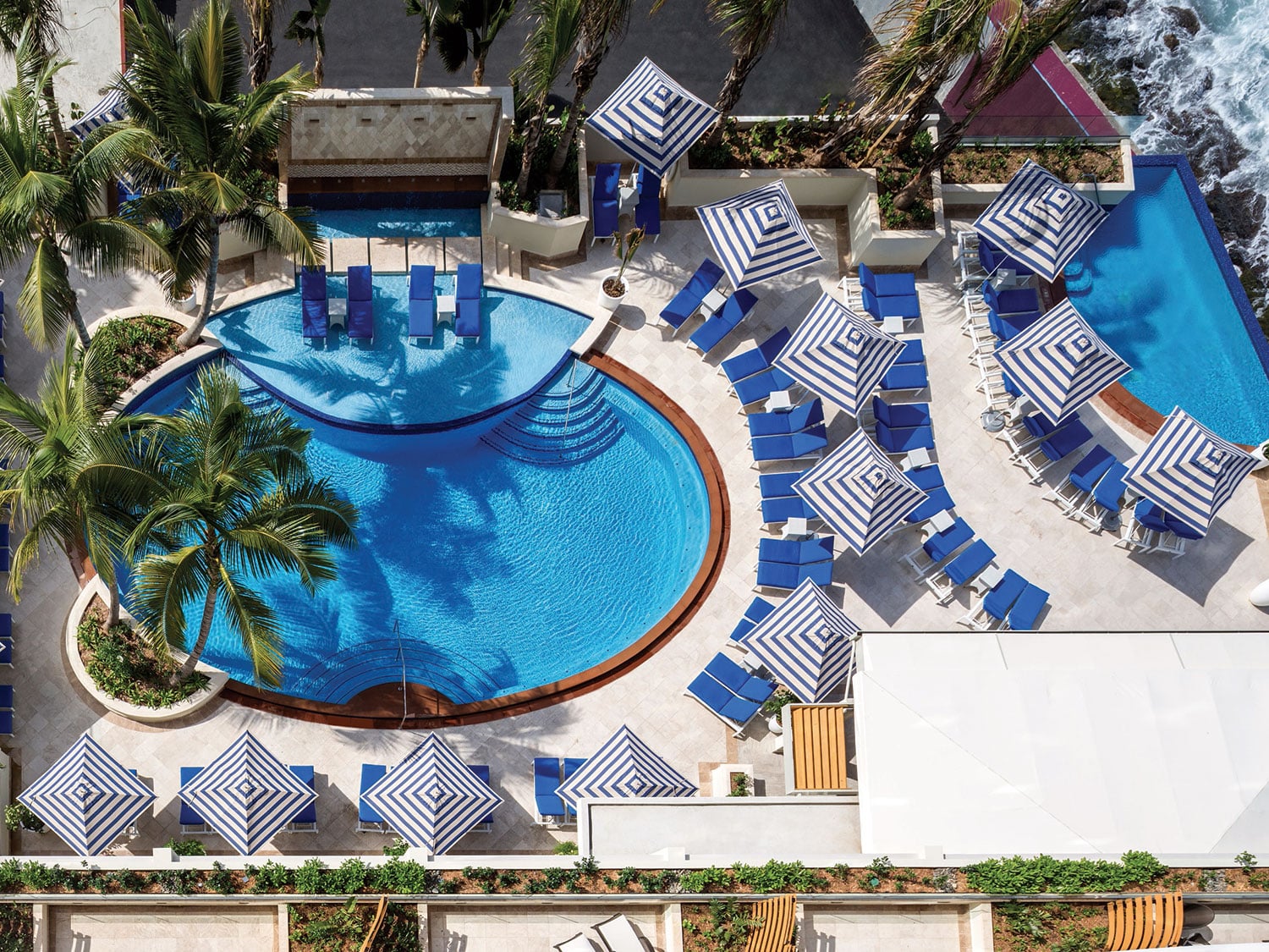 An aerial drone’s eye view of the infinity pool at The Condado Vanderbilt resort in San Juan, Puerto Rico.