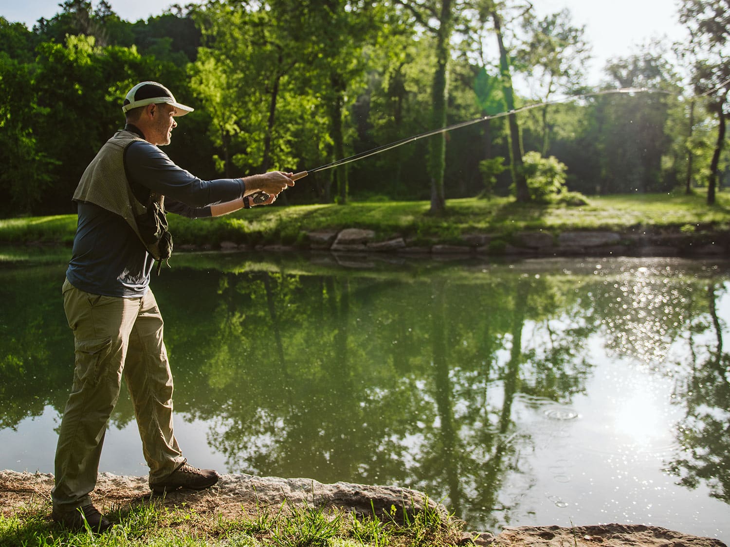 A fly fisherman leading lessons at Dogwood Canyon Nature Park in Missouri.