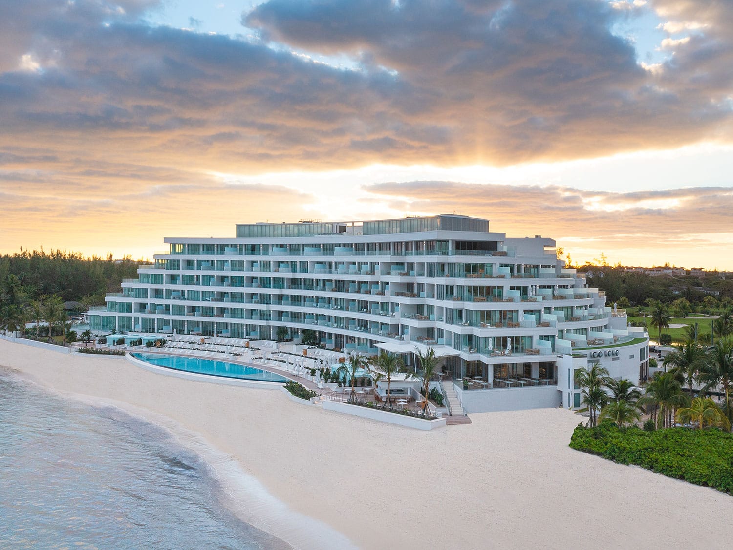 An exterior beachside view of Goldwynn Resort and Residences in Nassau, Bahamas.