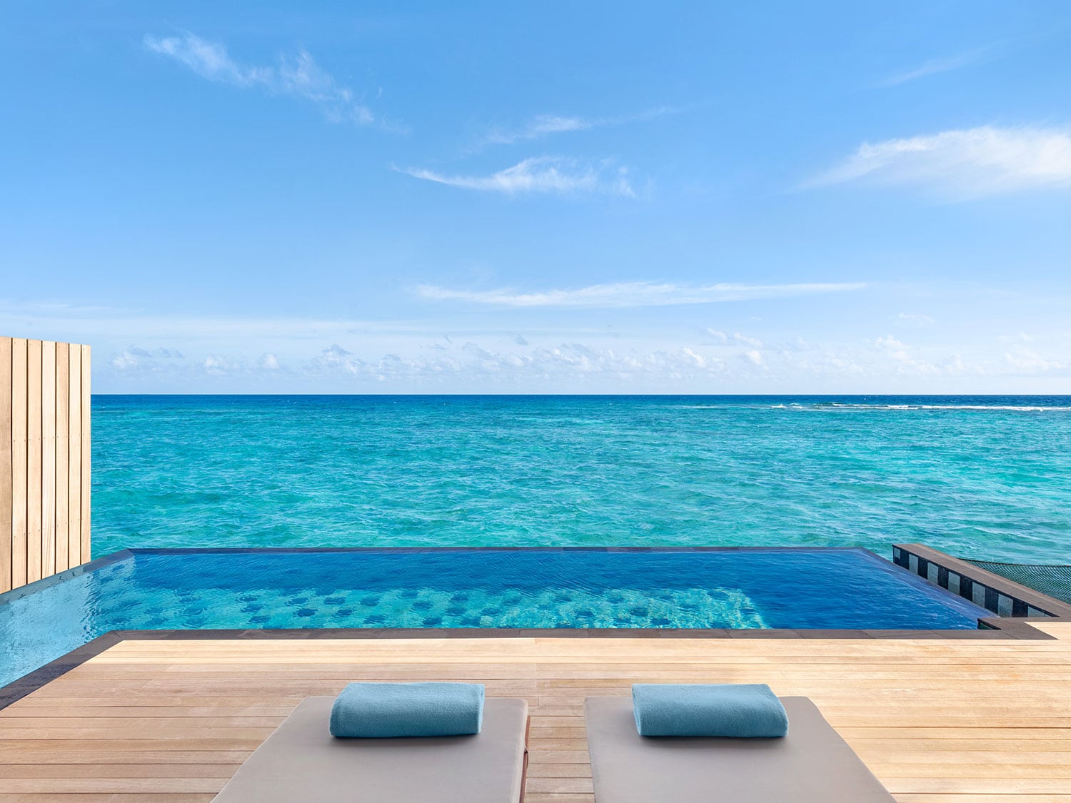 A private pool in an overwater villa at Hilton Maldives Amingiri Resort and Spa.