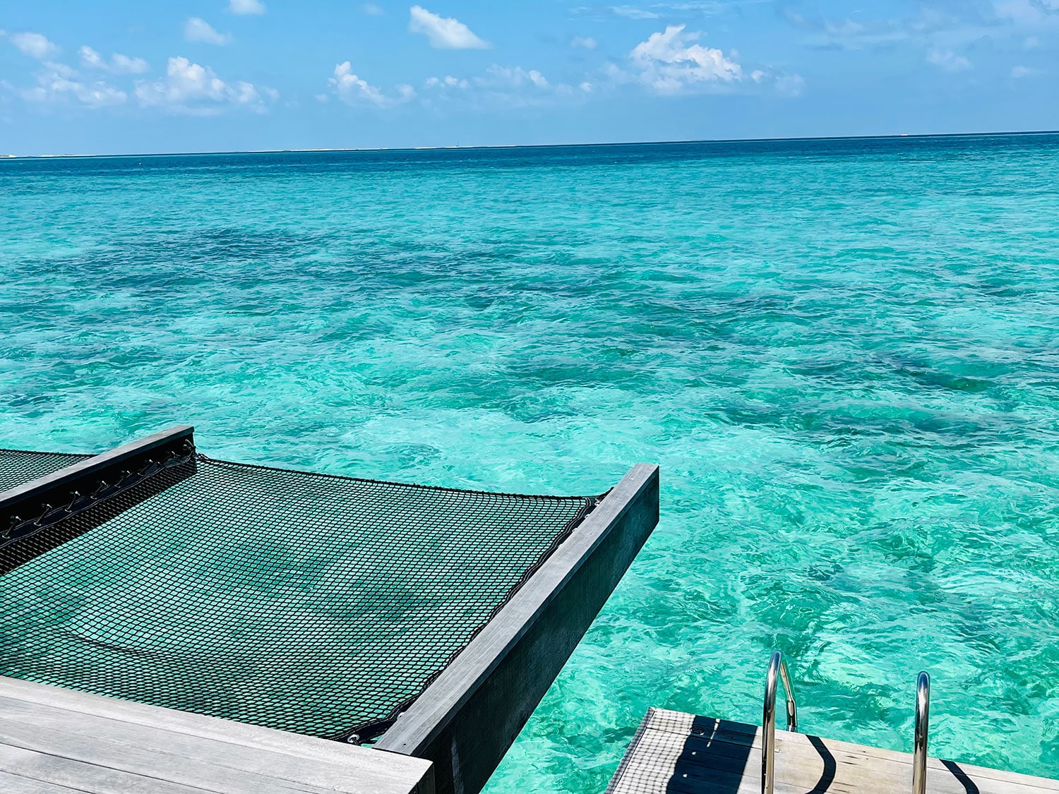 The deck of an overwater villa at Hilton Maldives Amingiri Resort and Spa in the Maldives.
