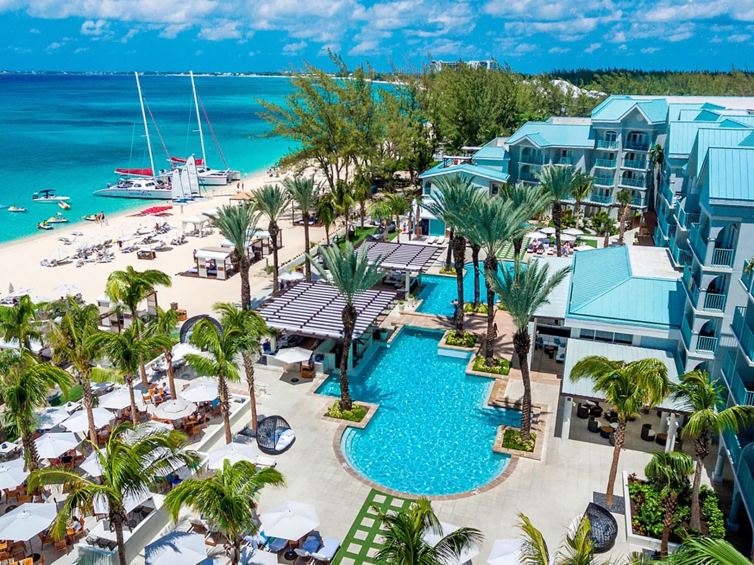 An aerial view of the pool and property at Westin Grand Cayman Seven Mile Beach Resort & Spa in the Cayman Islands.