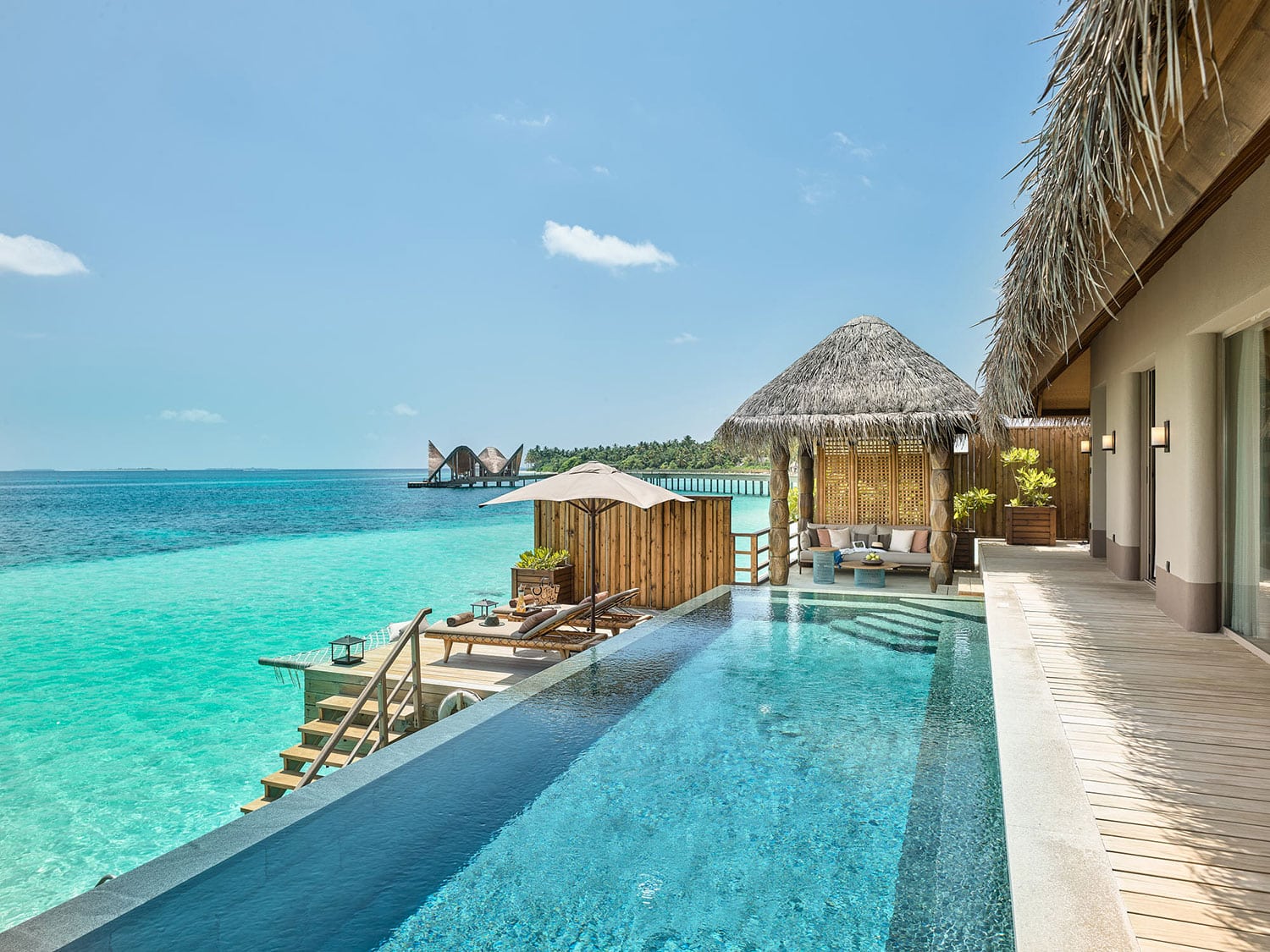 A pool view from a water villa at JOALI Maldives.
