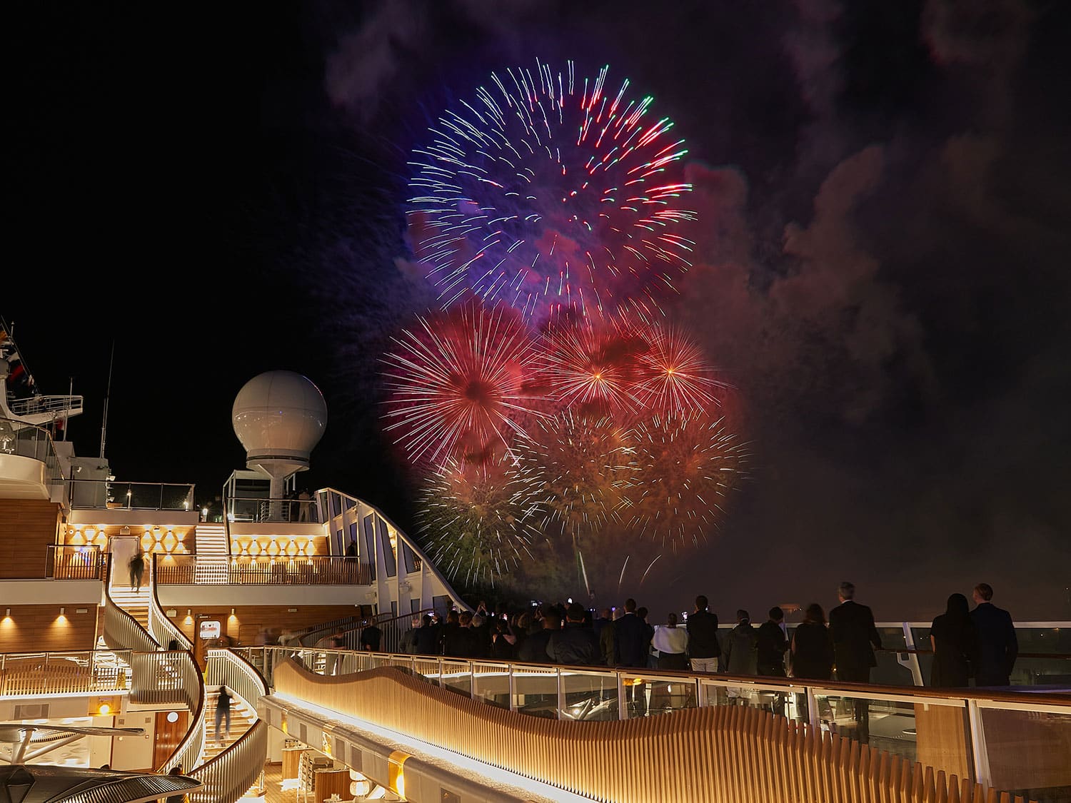 Guests watch fireworks on board the Oceania Vista during the cruise ship’s christening.