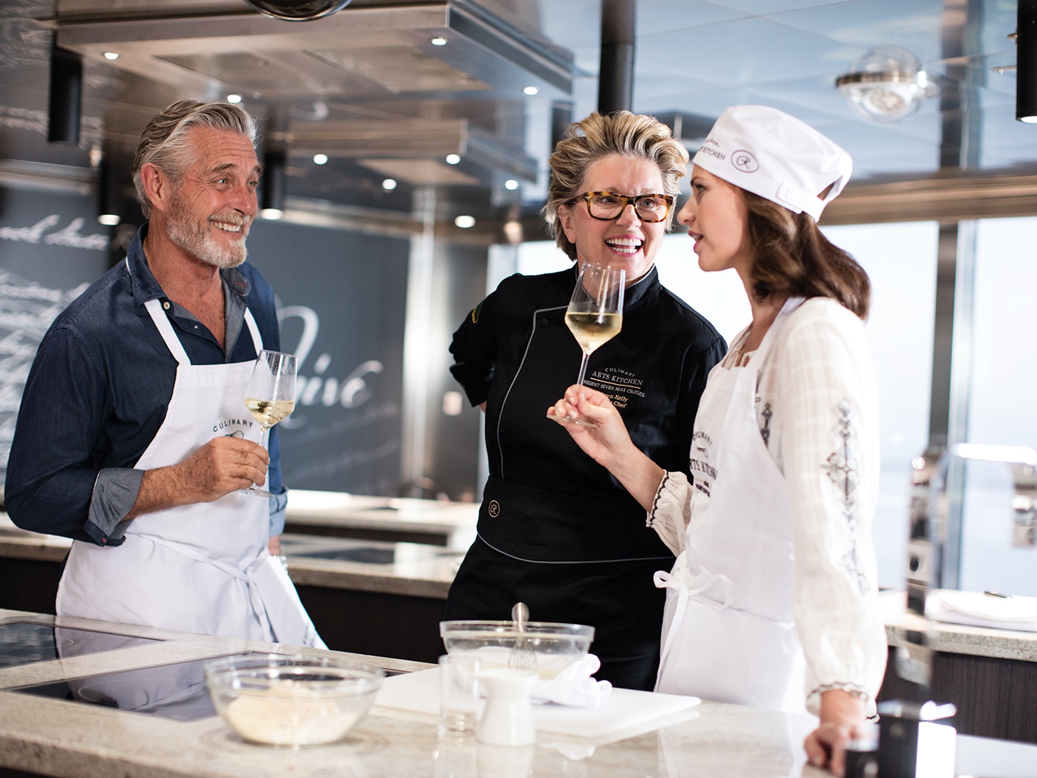 Executive Chef Kathryn Kelly with two Regent Seven Seas guests.