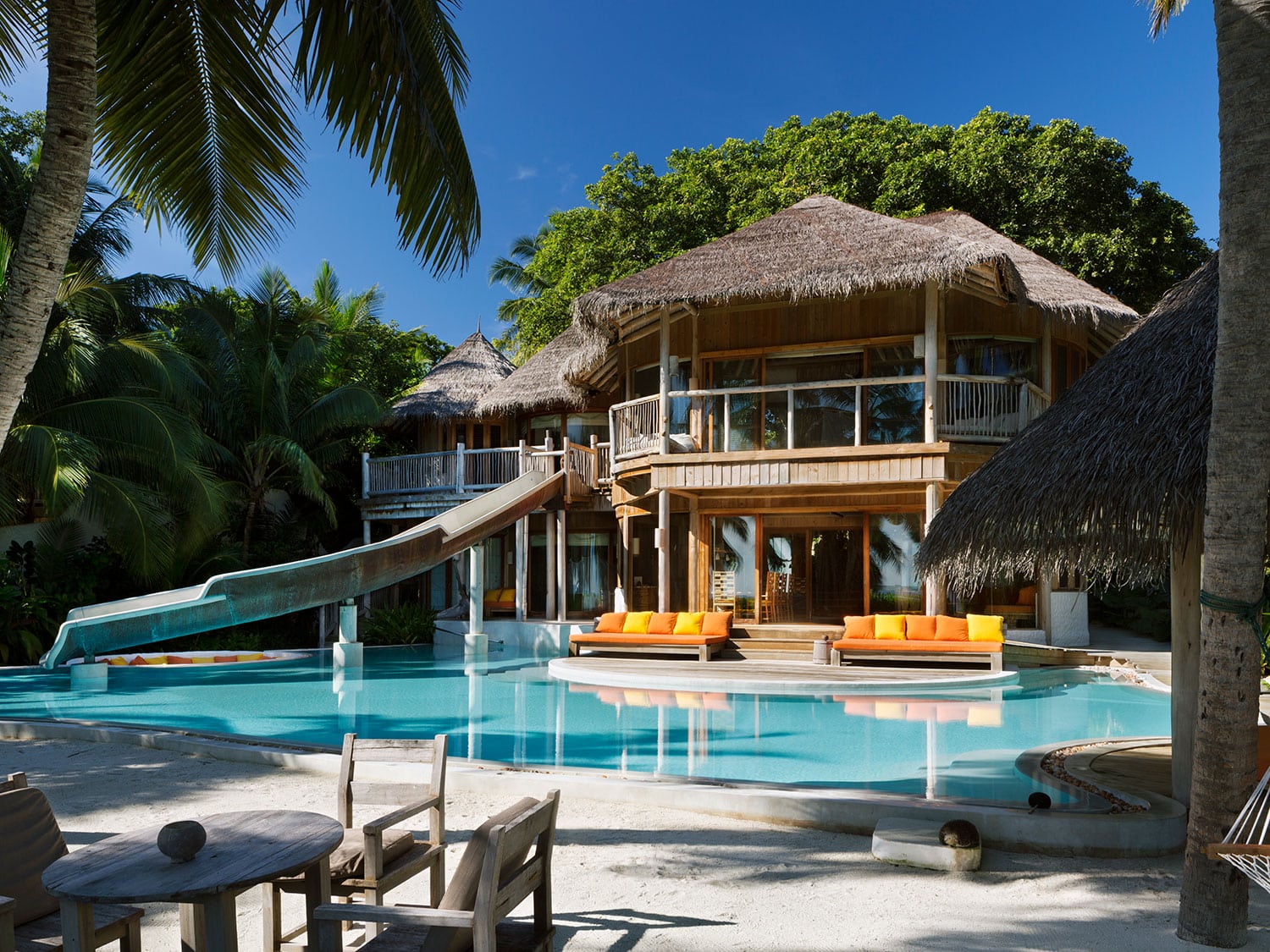 The exterior view of the pool and waterslide of Villa 15 at the Soneva Fushi resort in the Maldives.