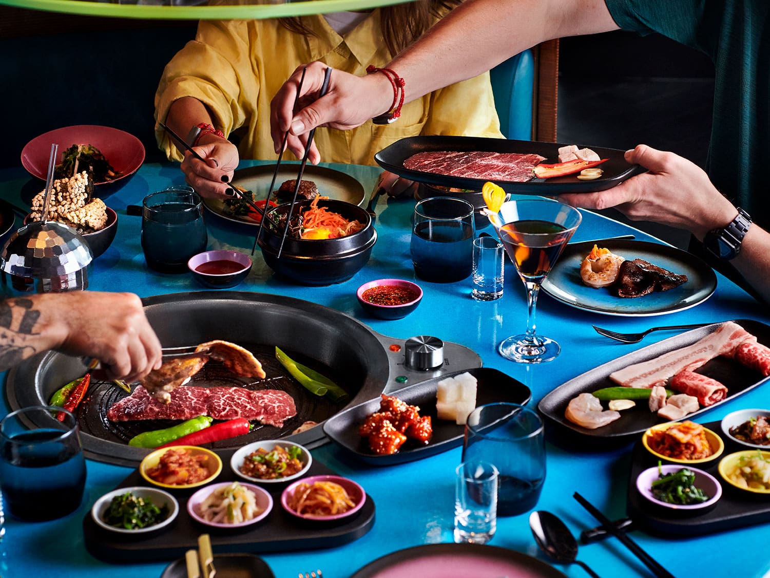 Various dishes at the Gunbae Korean BBQ restaurant aboard the Virgin Voyages Scarlet Lady cruise ship.