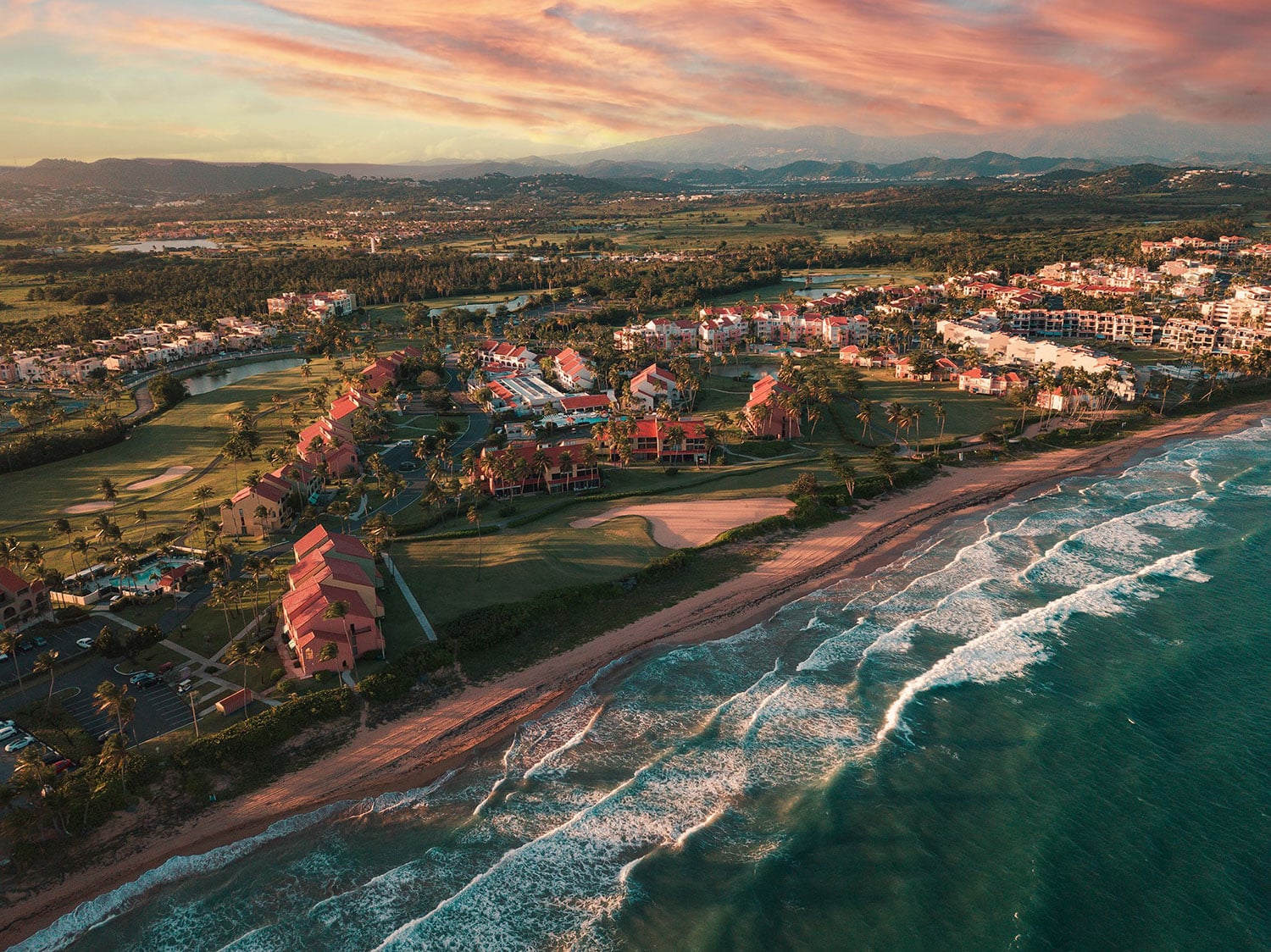 An aerial view of the property and beach at Wyndham Palmas Beach and Golf Resort in Puerto Rico.