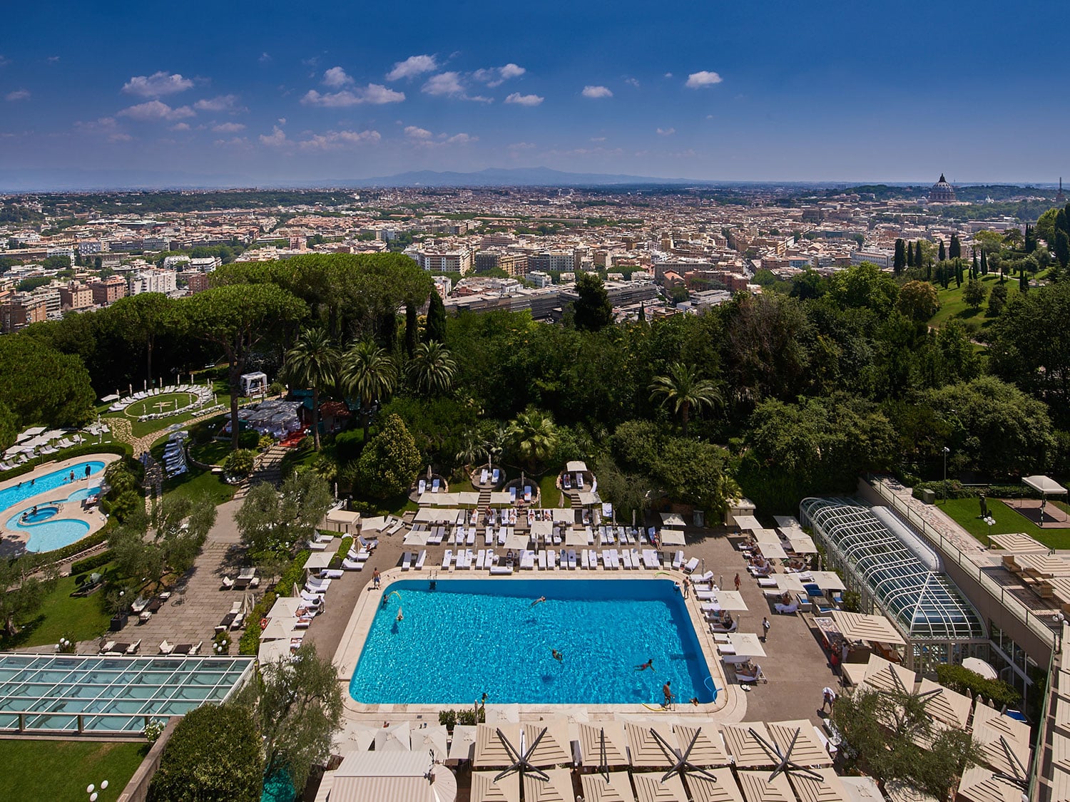 An aerial view of the property and surroundings of Rome Cavalieri, A Waldorf Astoria Hotel, in Italy.