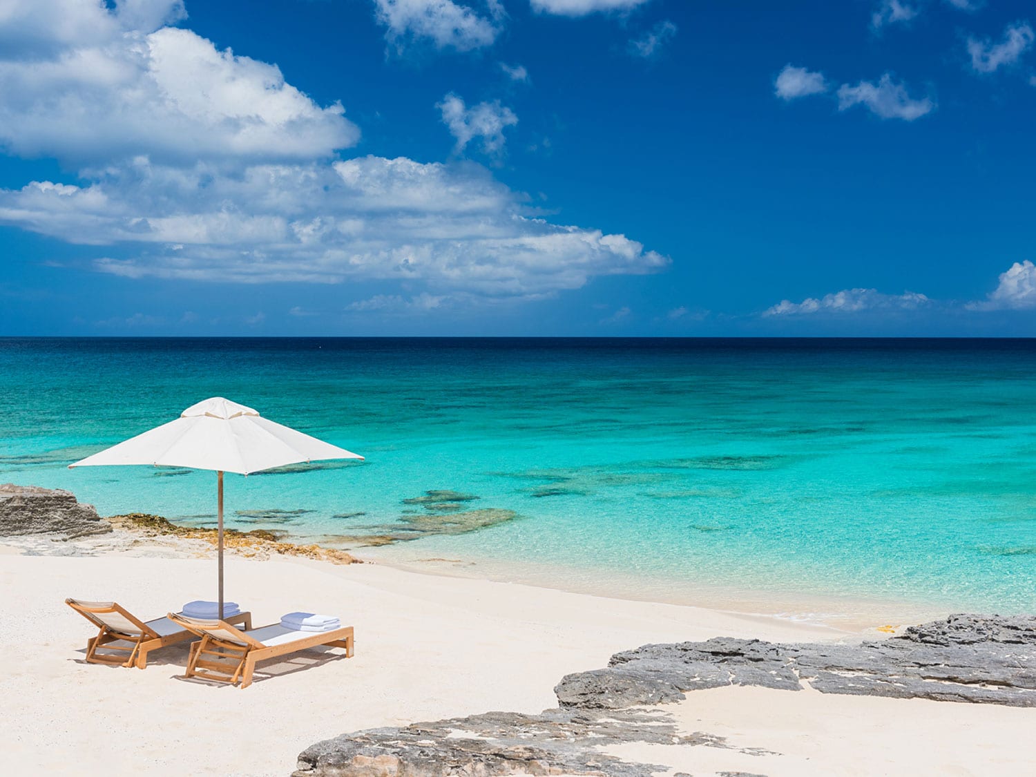 A pair of loungers on the beach at Amanyara in Turks and Caicos.