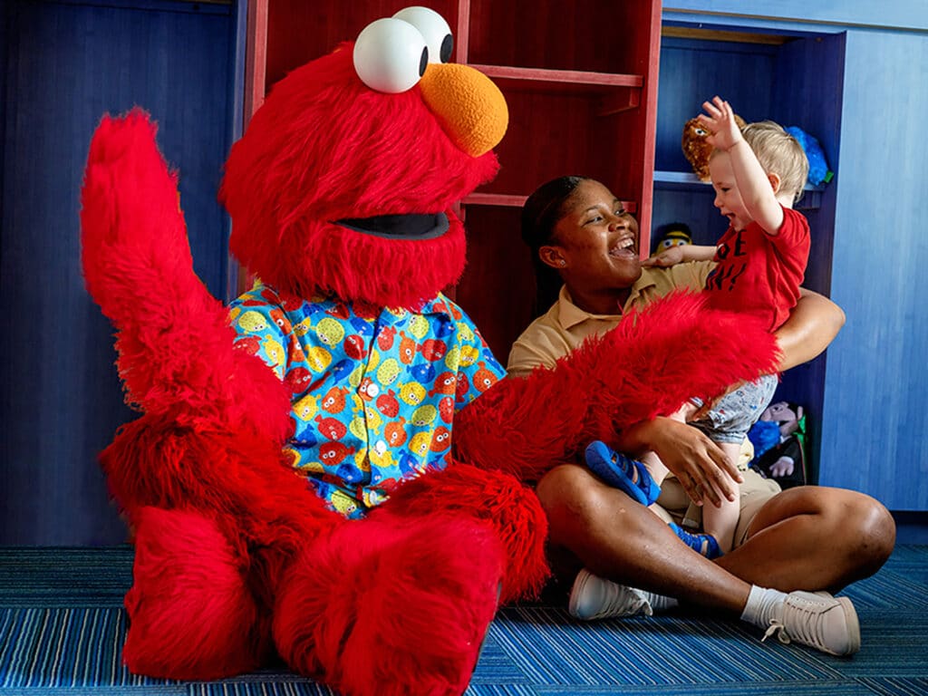 A child meets Elmo at Beaches Turks and Caicos