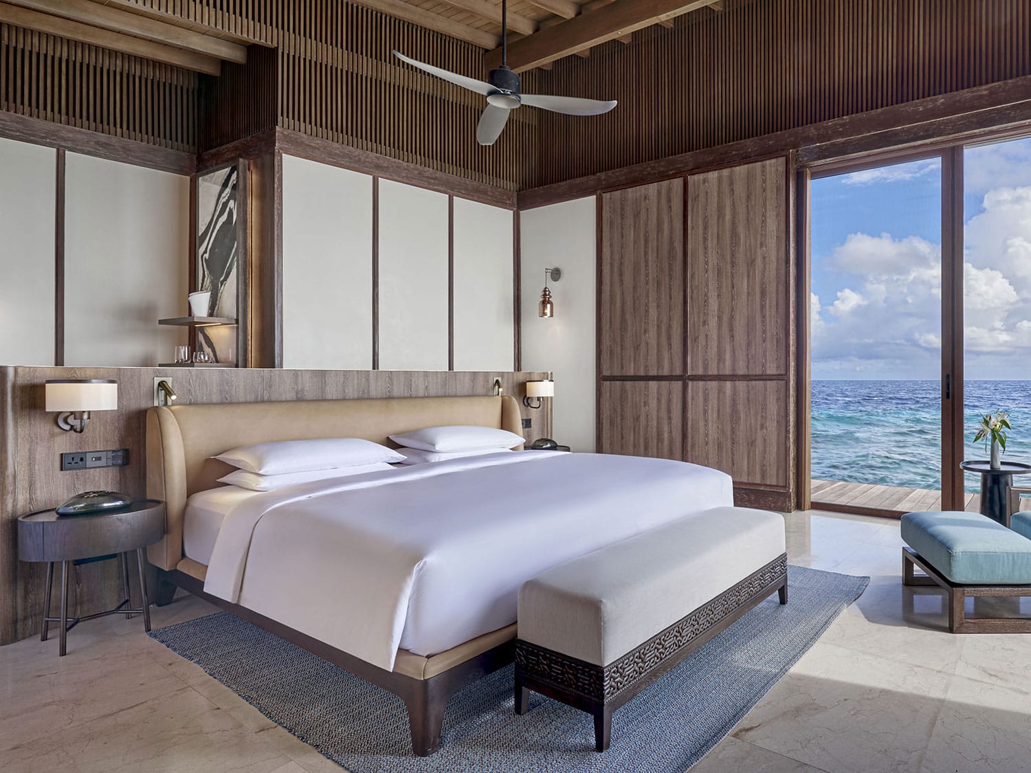 The interior of the master bedroom of the Overwater Reef Residence at Park Hyatt Maldives Hadahaa.