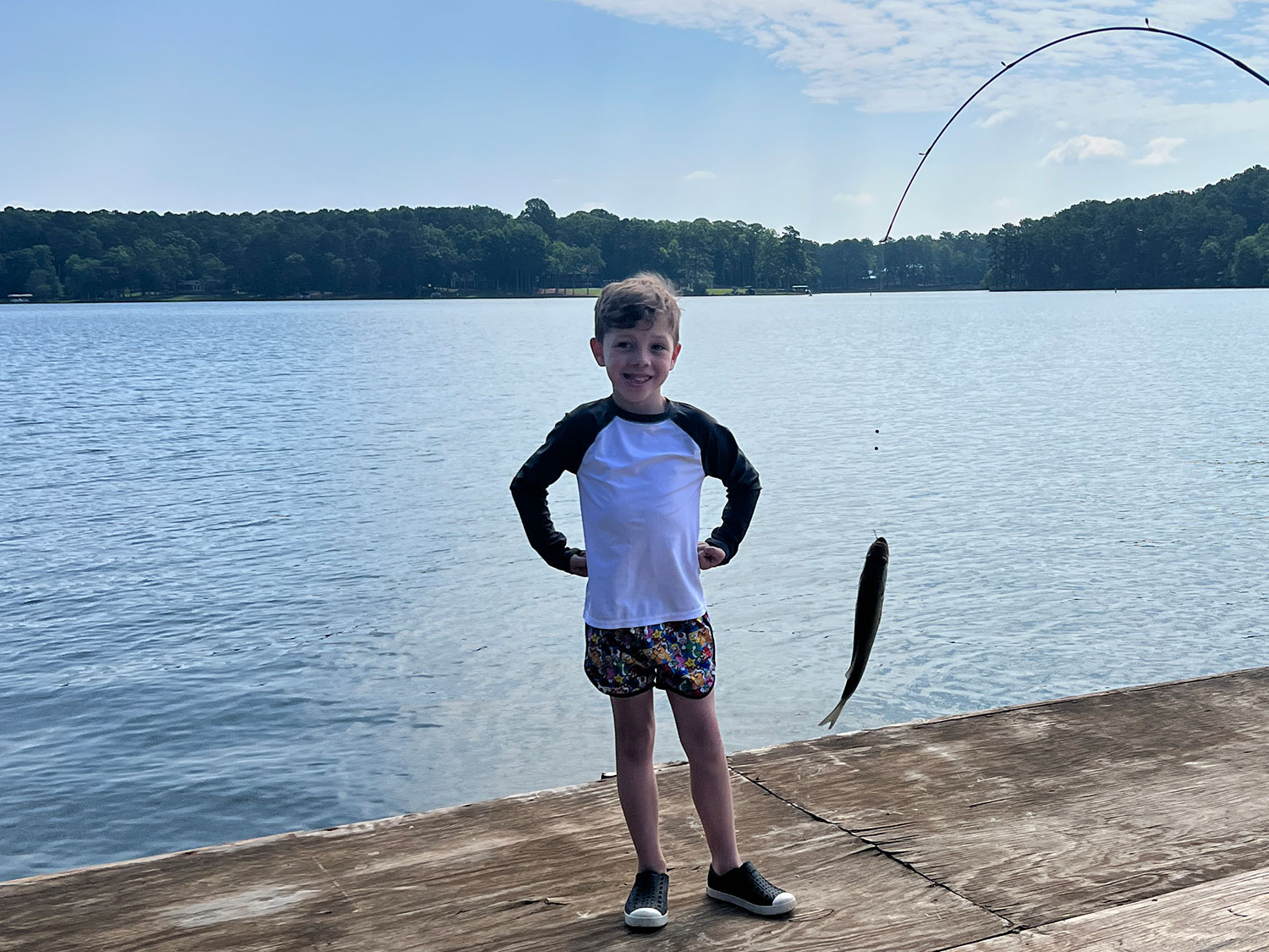 A child shows off the fish he caught at Reynolds Lake Oconee in Georgia.