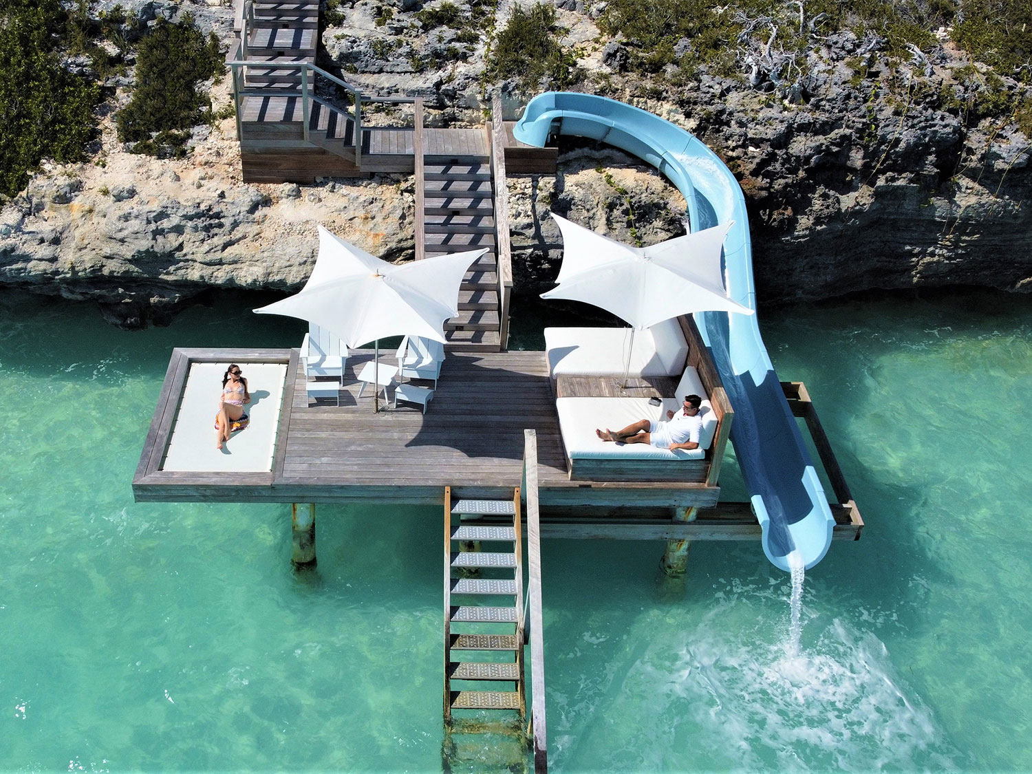 The deck and waterslide of the Amuse Villa at Wymara Resort and Villas in Turks and Caicos.