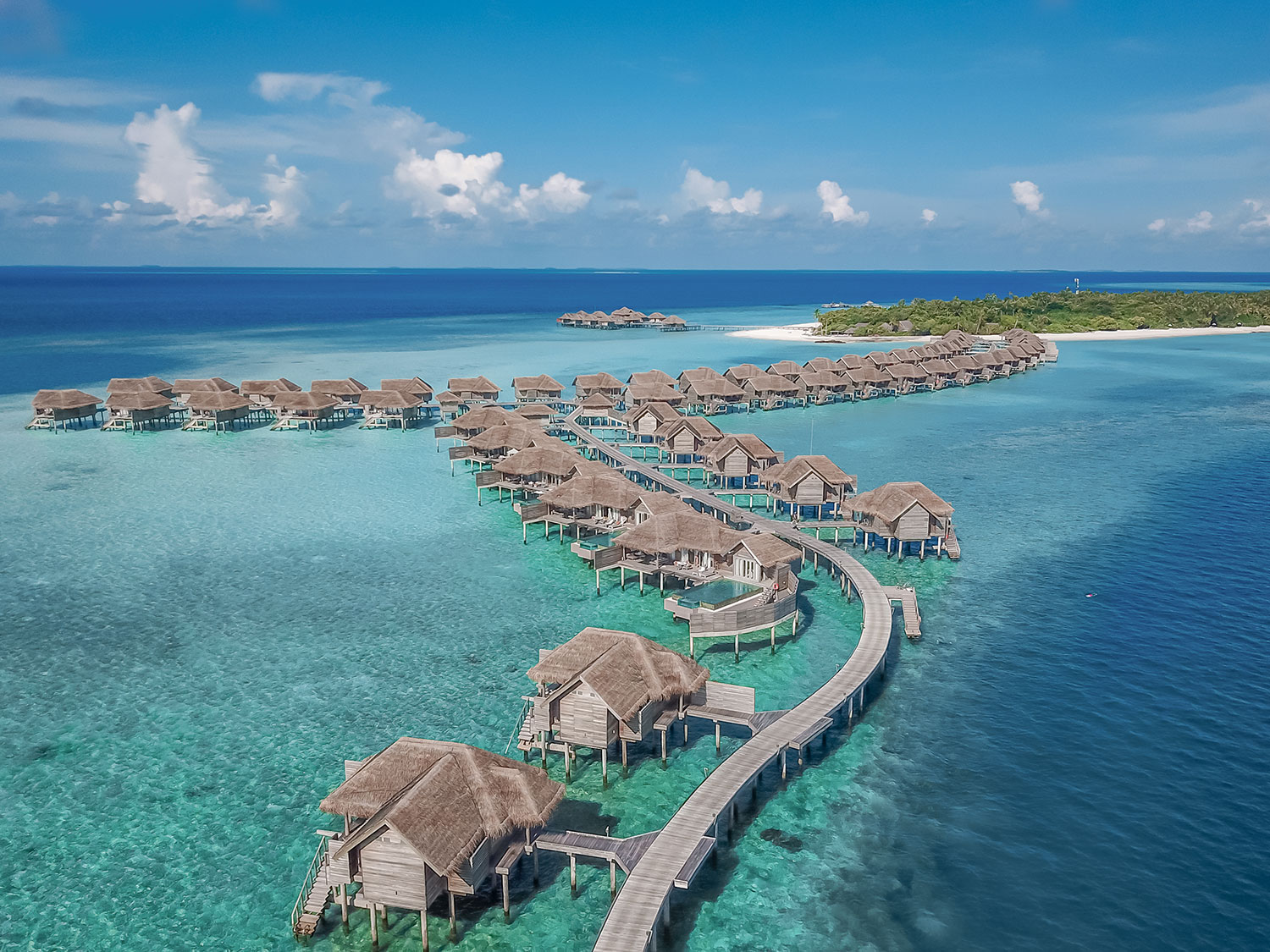 An aerial view of the overwater residences at Vakkaru Maldives
